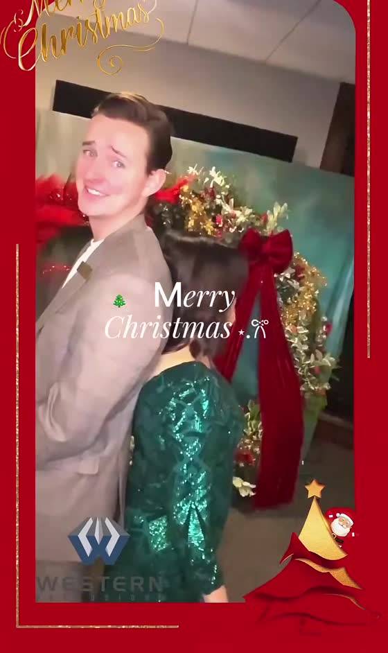 A couple in a festive on-screen frame