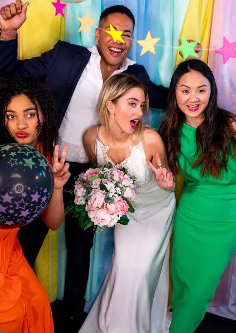 Wedding guests celebrating at the booth