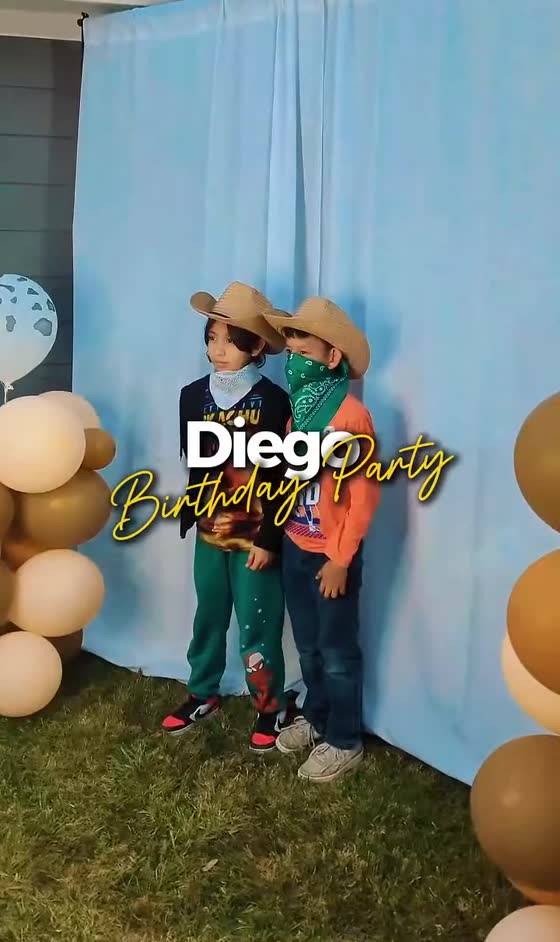 Outdoor birthday party against a blue backdrop
